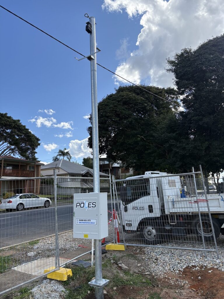 Temporary power pole with a Principal Poles truck on a suburban street